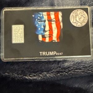 2.5 grams.999 FS bar on a Trump with the American Flag motif